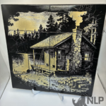 LASER ENGRAVE CABIN WITH FIREWOOD ON LAKE PROCESSED ON PAINTED TILE MOUNTED TO PINE BOARD FOR BACKING INCLUDES STAIN FRAME & STAND 12x12