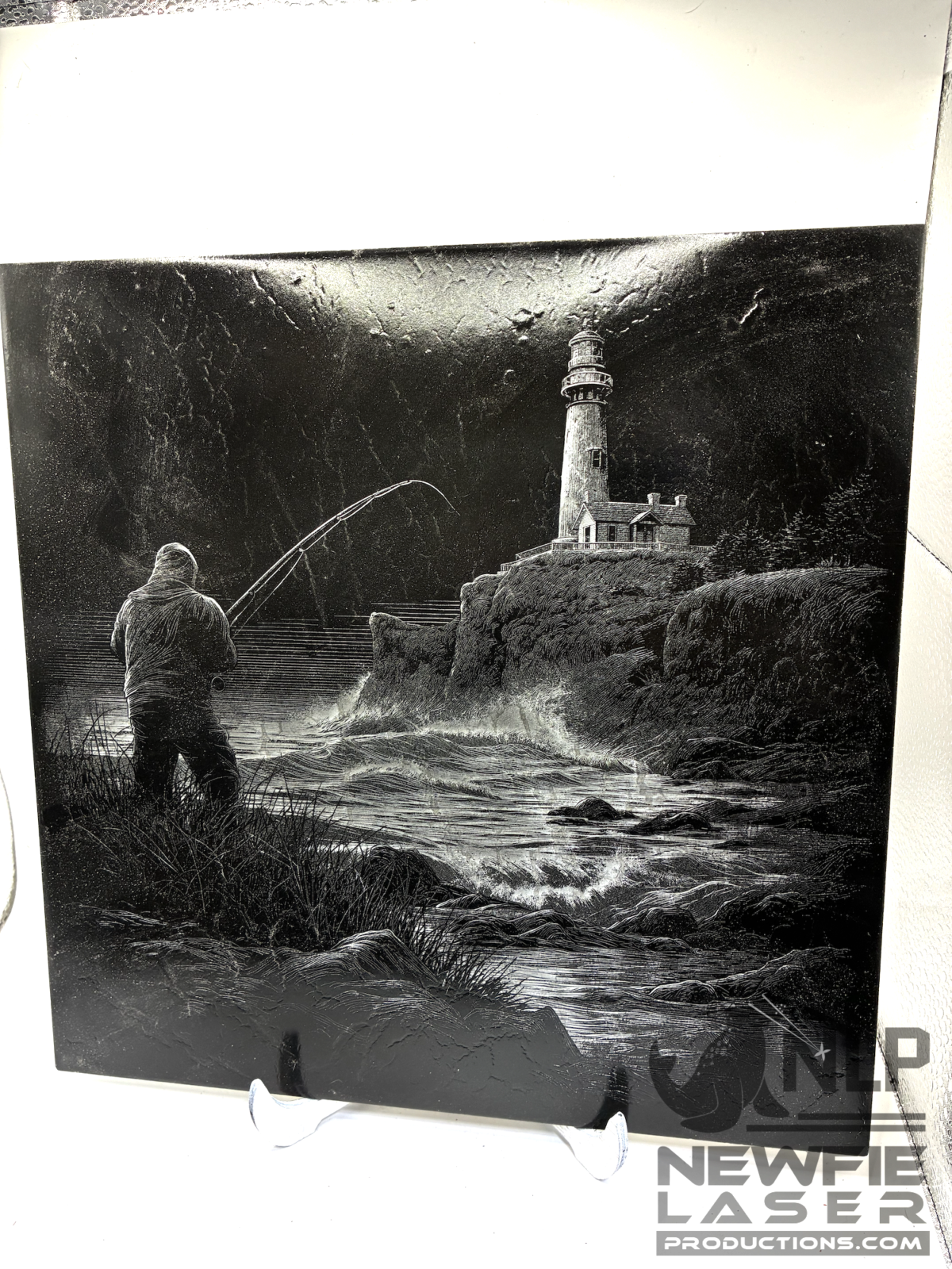 DEEP LASER ENGRAVED ON CERAMIC TILES MAN FISHING BY POND ENGRAVED.ON CERAMIC TILE CLEAR COAT ADDED & INCLUDES STAND 12X12